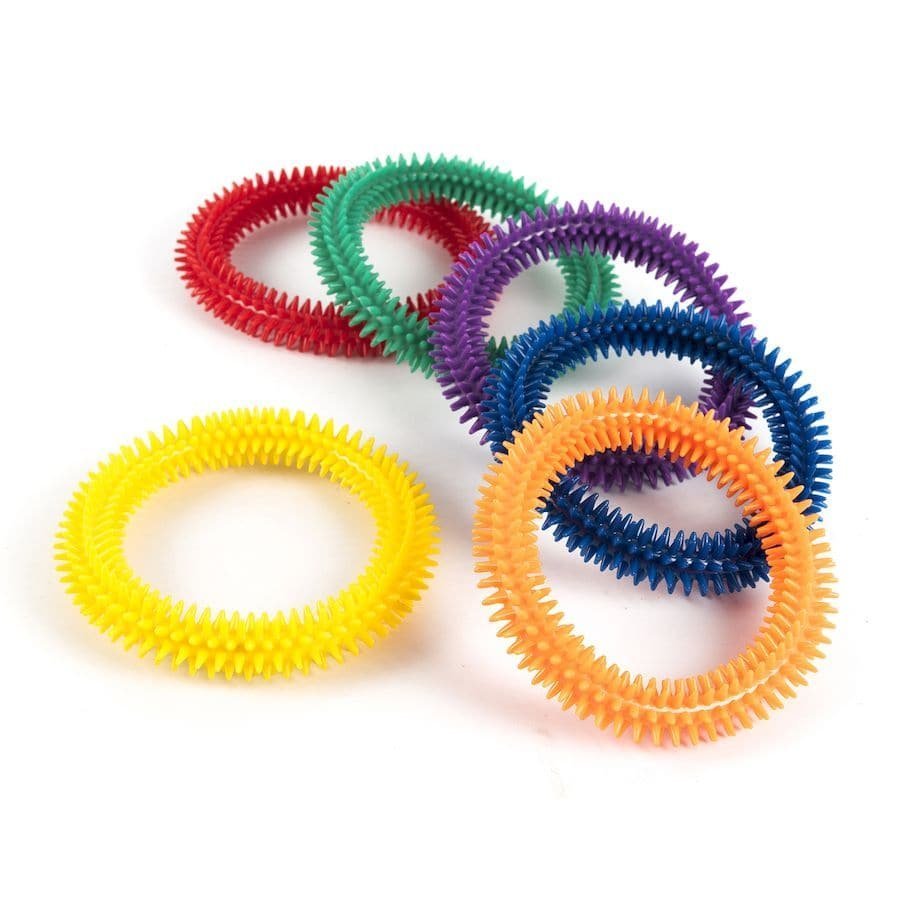 Aku Textured Ring, The Aku Ring is a soft and flexible ring and is designed with textured bumps, which transmit a pleasant sensory impulse. The Aku Ring is both easy to hold and flexible, these Aku rings provide tactile stimulation to the child. You can throw the Aku Ring, massage them all over your body or throw them to the bottom of the water and encourage the child to pick them up. The peculiarity of this Aku Ring tool makes it suitable for various applications. Flexible and textured, it is used in sever