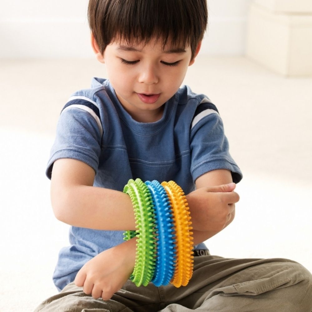 Bendy Twisters, Introducing the Weplay Bendy Twisters: The Ultimate Sensory Experience for Hands and Wrists! Uniquely Designed for Tactile Stimulation Composed of three squeezable and twistable silicon rings, the Bendy Twisters offer a delightful tactile experience. Designed to stimulate tactile awareness, these textured circles are perfect for both young and old. Variety in Colors and Resistance The Bendy Twisters set includes three large rings in bright, inviting colors: yellow, green, and blue. Each ring