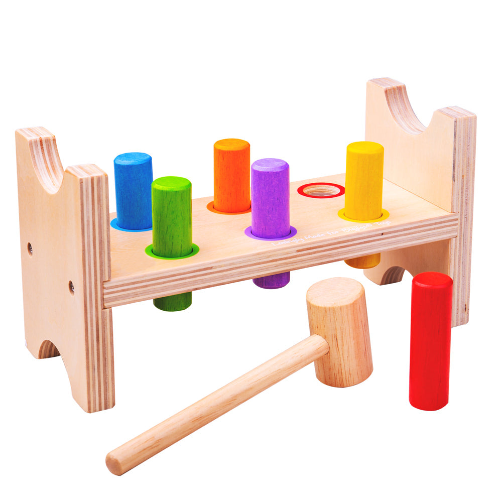 Bigjigs Toys First Hammer Bench, Help develop your little one's hand-eye coordination with the Bigjigs First Hammer Bench. Your child can simply tap on the brightly coloured wooden pegs with the sturdy but lightweight hammer to flatten them down to the workbench, then turn the whole thing over and start again! The Bigjigs Toys First Hammer Bench is the perfect way to learn cause and effect as well as developing good coordination and dexterity. The bright colours are eye-catching for visual stimulation and t