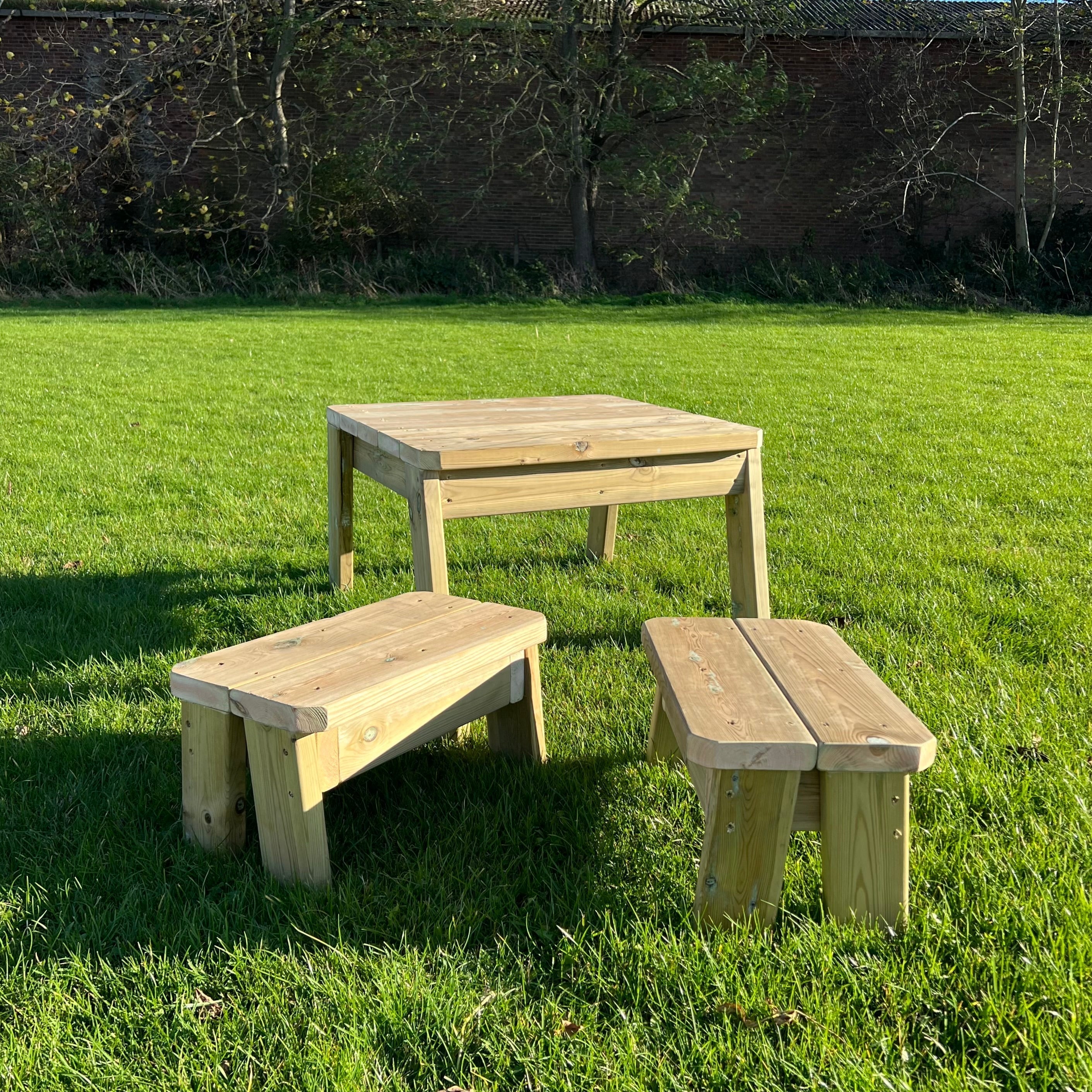 Children's Outdoor Mini Table and Benches, Every early years, educational environment needs outdoor seating! The Children's Outdoor Mini Table and Benches are suitable to accommodate at least 2 children at once. It is the perfect seating set to enjoy lunchtime outdoors.Robust and built in a square shape, this resource can be used in multiple outdoor lessons. The Children's Outdoor Mini Table and Benches is made from sustainable FSC Pressure Treated Redwood Timber. Delivery 4-6 weeks Delivered fully Assemble