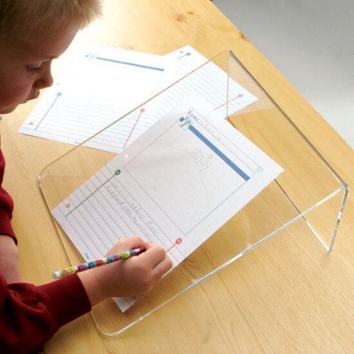 Clear Writing Slope, The Clear Writing Slope enables children to work and write at the optimum angle, encouraging good handwriting practice. Some children hunch over the desk when writing on a flat surface, which can sometimes lead to the development of an incorrect posture and poor motor control and the Clear Writing Slope helps resolve this. The Clear writing slope prevents children from bending over their desk, and maintains the optimal writing posture, which prevents strain on neck, shoulders and back. 