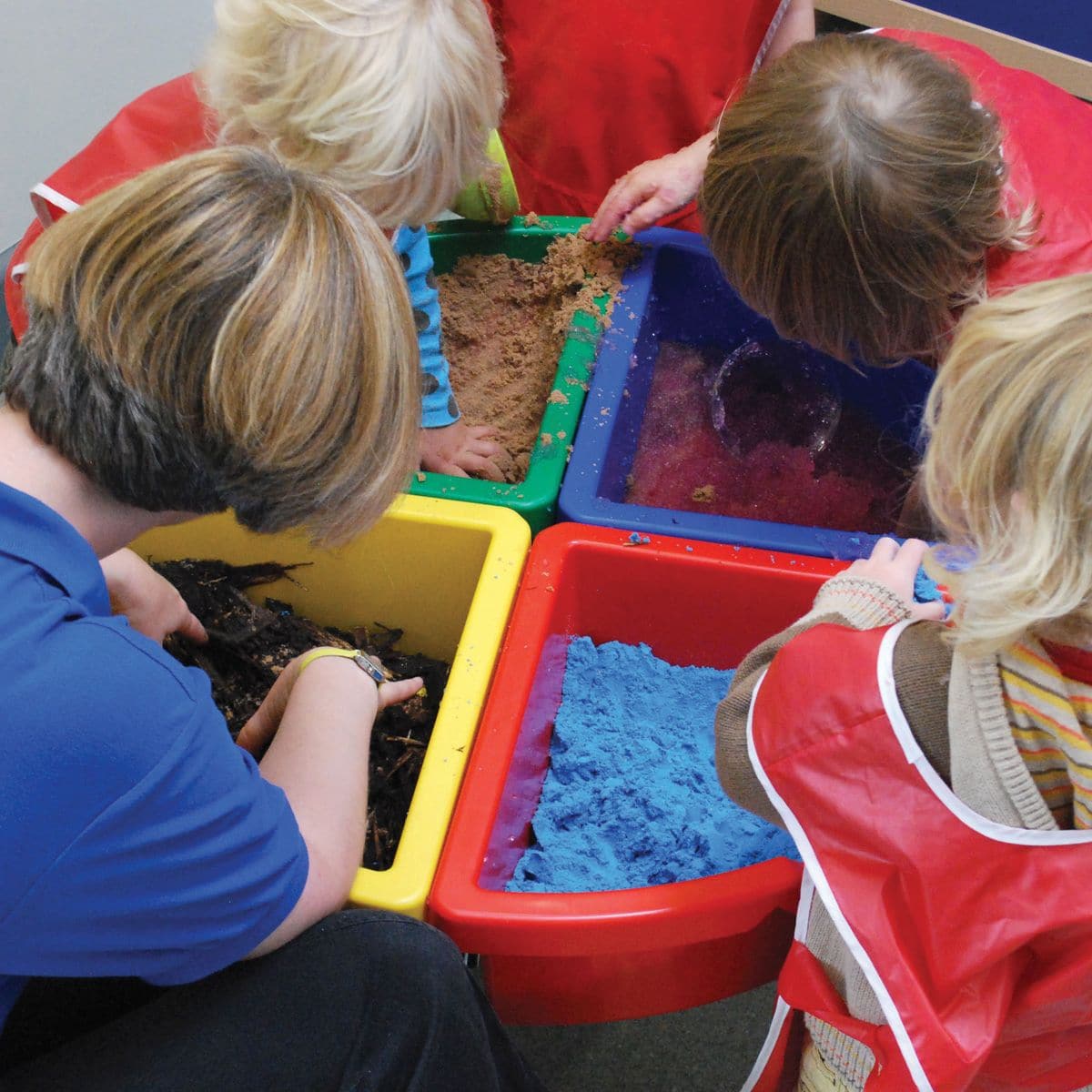Exploration Circle Set Colour Trays, The Exploration Circle Set Colour Trays has 4 coloured quadrant trays with a grey metal stand forming a sturdy activity circle. Using the Exploration Circle Set Colour Trays,Children can play and discover the properties of sand, water, confetti, wood chippings or whatever medium you decide to place into the handy sized trays which are easy to manage, clean, lift and empty with this stunning Exploration Circle Set Colour Trays. The Exploration Circle Set Colour Trays is i
