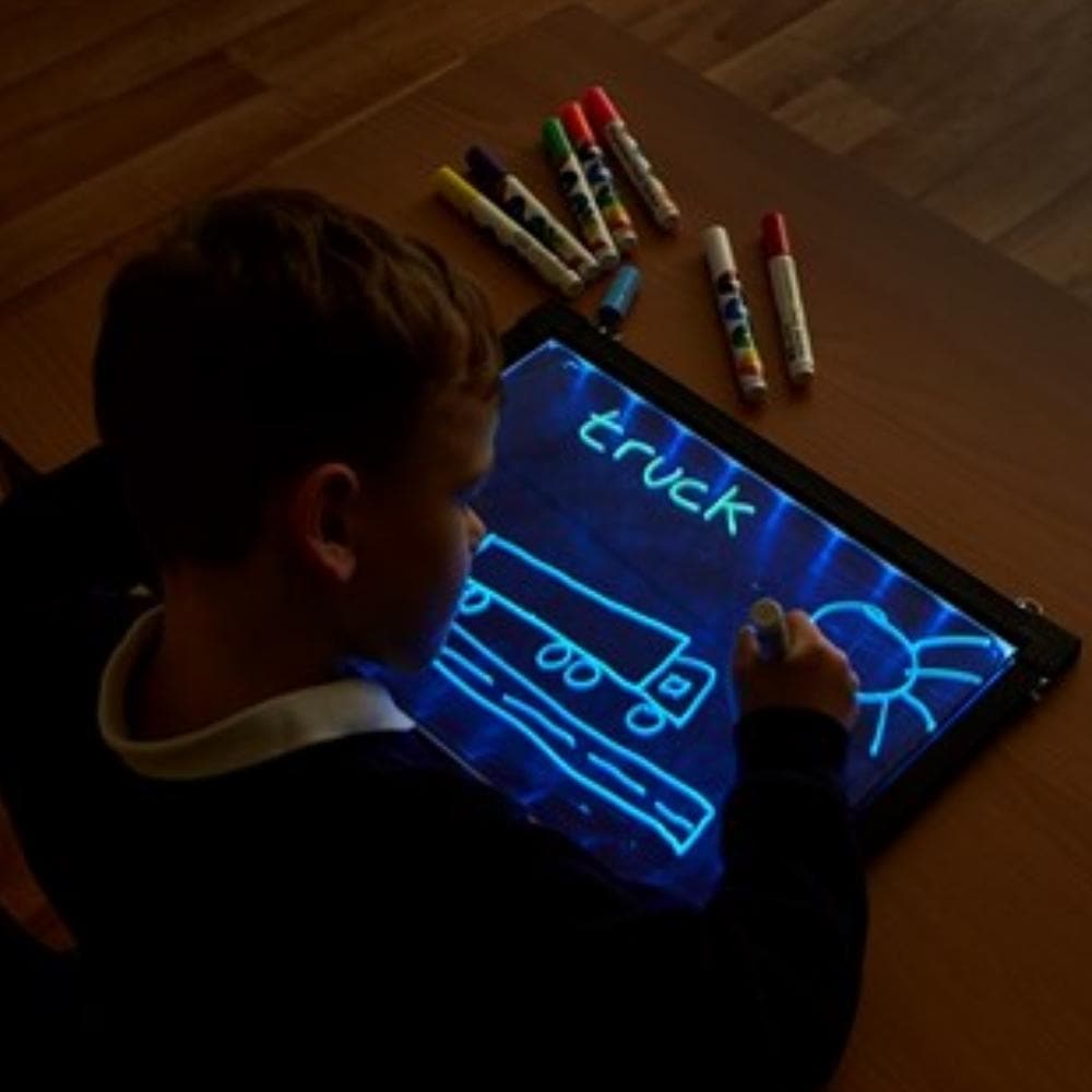 Glow Writer Panel 30 x 40cm, Even your most reluctant writers will want to work on a Glow Writer Panel. Expect an 'ahh wow' reaction when you turn on the Glow Writer and begin using the fluorescent chalks to write. This Glow Writer Panel is a great value handwriting resource has a dry wipe surface and a series of LEDs that light up the black board with a rainbow of colour, bringing writing and drawings to life through a multi-sensory approach. Engage reluctant writers with a vibrant, exciting and multi-sens