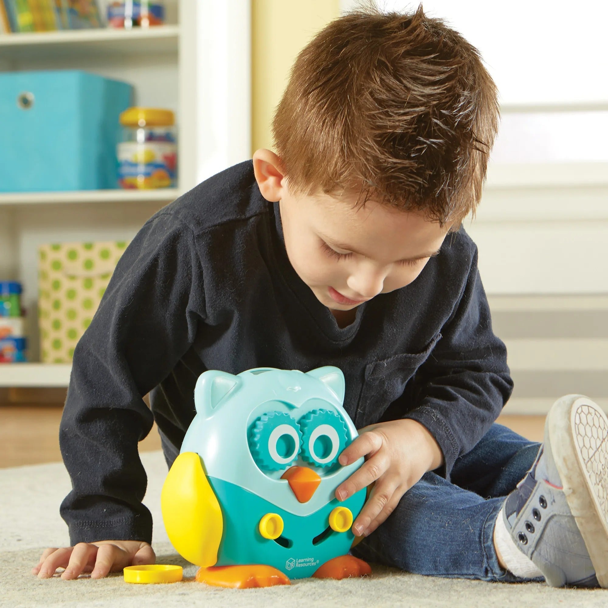 Hoot the Fine Motor Owl, Discover Hoot the Fine Motor Owl! Use the coloured coin counters with different functions on the owl, helping children learn strength, hand-eye coordination, grip and scissor skills through five fun hands-on activities. Hoot Hoot! Whoooooo's that adorable owl? It's Hoot the Fine Motor Owl, a wise addition to the collection of fine motor toys for toddlers! Inspired by our bestselling Spike the Fine Motor Hedgehog. Hoot is here to help kids prepare for preschool success with four fun 