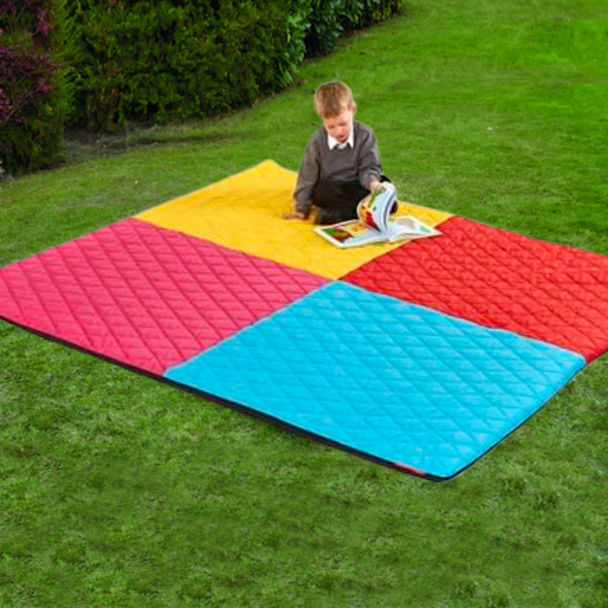 Indoor and Outdoor Large Quilted Harlequin Mat 2000 x 2000mm, This Large Quilted Harlequin Mat is large enough to seat the whole class. Features a vibrant harlequin design perfect for nurseries, pre school and early years environments. The mat is made of a high quality foam inner and covered in quilted polyester for extra comfort and durability. Can be used indoors and outdoors. This Large Quilted Harlequin Mat is large enough to seat the whole class. Features a vibrant harlequin design perfect for nurserie