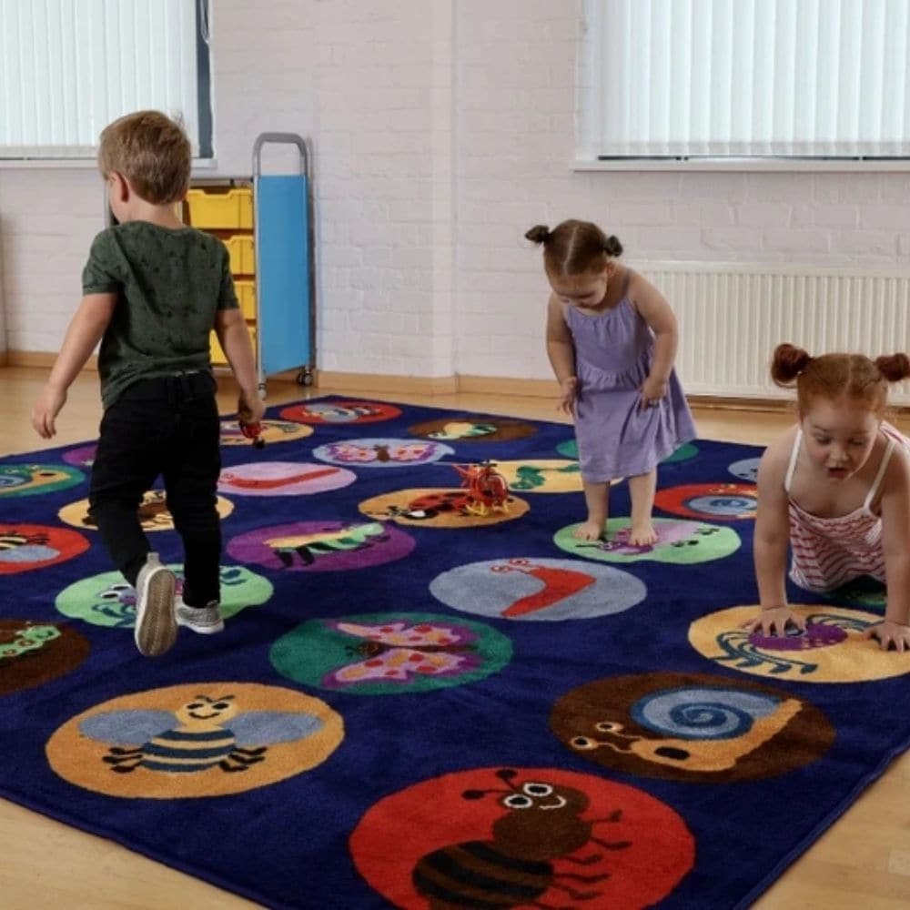 Kinder™Mini Beasts Carpet 3 x 3 Metre, The Kinder™Mini Beasts Carpet is a 3-metre square placement carpet with clearly identifiable seating areas for up to 30 children. The brightly coloured mini beasts carpet include a caterpillar, snail and ladybird.The Kinder™Mini Beasts Carpet is a substantial premium quality carpet, with an extra thick pile, soft textured tufted Nylon twist pile designed specifically for comfort and longevity. Ideal for Early years and primary school learning environments. Mini Beasts 