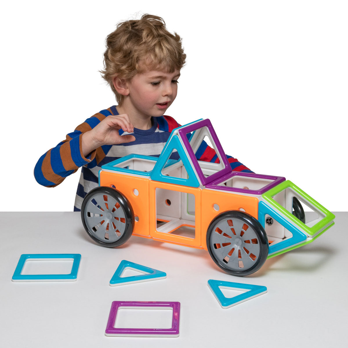 MegaMag Mobil Set, The MegaMag Mobil Set is the perfect building set for little engineers who love cars, trucks, and buses. With 28 chunky magnetic pieces, including 14 squares, 6 equilateral triangles, 4 squares with holes, and 4 wheels, children can create their favorite moving vehicles and bring their imagination to life.This set is not only incredibly fun but also educational. It encourages students to explore geometry and helps them identify the properties of 2D and 3D shapes. By manipulating and joini