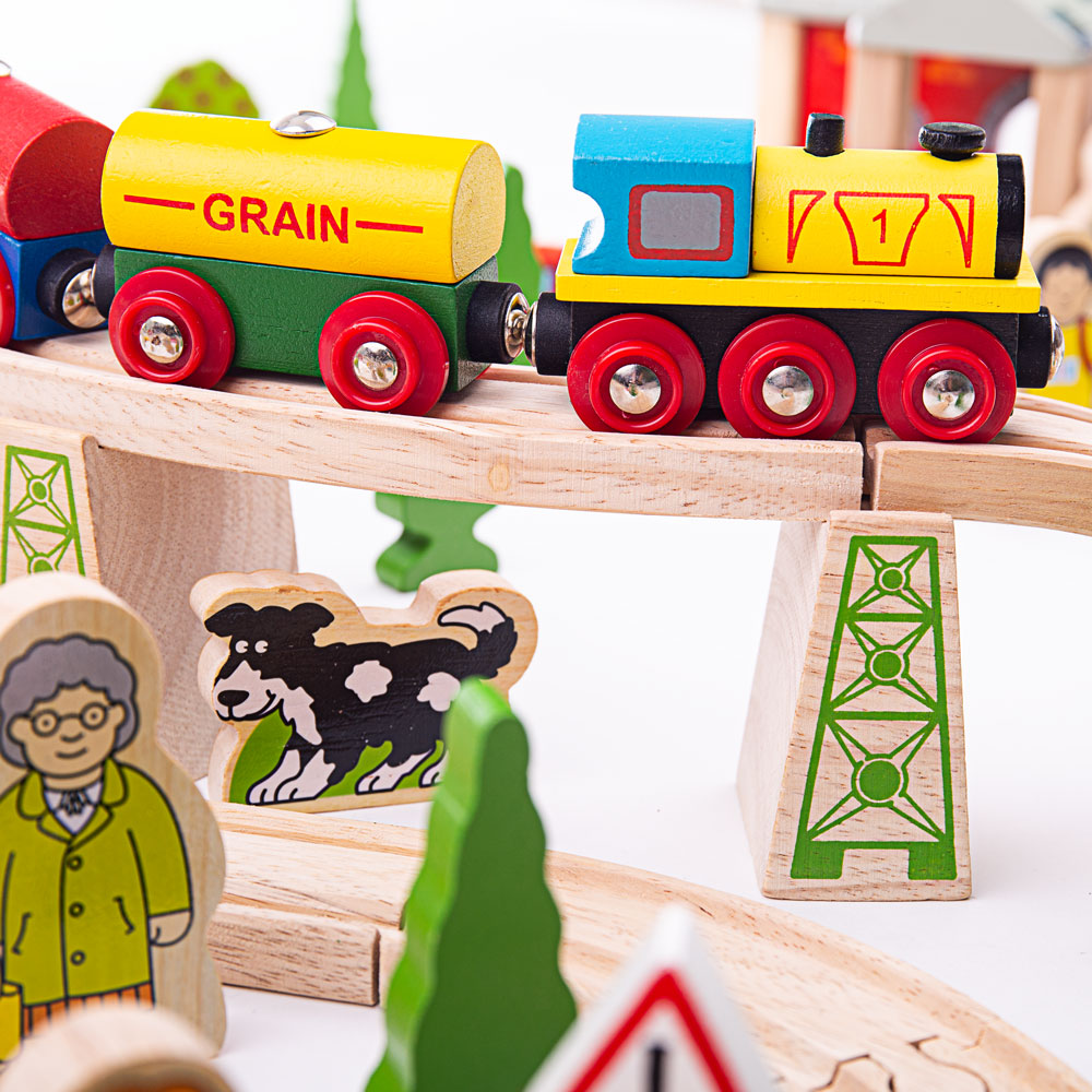 Mountain Railway Set, Mini mountaineers are going to love playing with our Mountain Wooden Train Set. This wooden railway set towers above other train sets and comes packed with a range of activities to broaden and educate young minds. In this kids wooden train set is a working crane, a classically styled railway station plus a turntable, bridges and viaducts among the many train set components. Wooden cars, commercial vehicles, workmen and village folk all help to populate the busy landscape. Consists of 1
