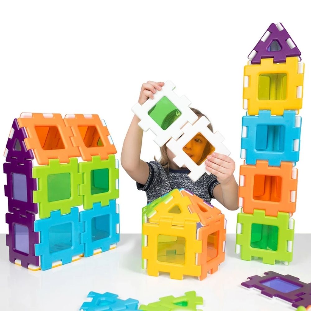 My First Polydron Windows Set 72 Piece, Introducing our first Polydron Windows Set, specially designed to bring excitement and creativity to an entire class! This set is perfect for collaborative learning, allowing multiple children to engage in constructive play simultaneously.As light passes through the vibrant, translucent pieces, a mesmerizing display of colors and patterns come to life. It truly looks spectacular against any light source, captivating young minds and igniting their imagination.With its 