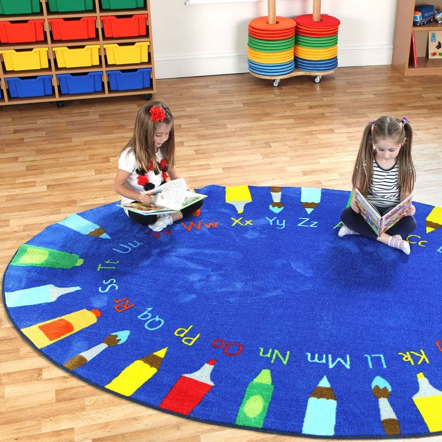 Oval Pencils Alphabet Carpet, This highly visual, Oval Pencils Alphabet Carpet combines learning the letters of the alphabet and colour recognition. An essential when teaching literacy, introducing letter formation and testing children's ability to recognise the difference between capital and lower case letters. The Oval Pencils Alphabet Carpet is finished with an extra thick pile designed specifically for comfort and longevity. Rainbow oval 3x2m carpet depicts pencils and the alphabet. Decorative carpet th