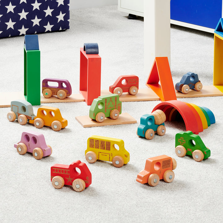 Rainbow Wooden Vehicles Set - Pk12, Our TickiT® Rainbow Wooden Vehicles are fantastic for little transport enthusiasts! The Rainbow Wooden Vehicles Set are made from beautiful smooth solid beechwood with a natural woodgrain finish in the 7 different colours of the rainbow. These colourful and tactile Rainbow Wooden Vehicles have intricate laser detailing, rotating wheels, and robust metal axles. Ideal for your child to use in imaginative play, small world play, and to encourage descriptive language skills a