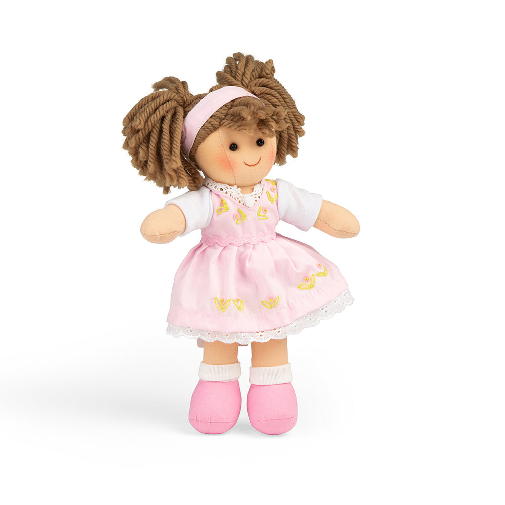 Rose Doll - Small, Introducing Rose, the softest and most lovable doll you'll ever meet! With her delicate features and irresistible charm, she will capture your heart in an instant. Dressed in a beautiful lacy pink dress, Rose exudes elegance and grace.Her bunched brown hair adds a touch of playfulness to her overall appearance. You won't be able to resist running your fingers through her silky strands as you play and create endless hairstyles together. Whether you're braiding, brushing, or simply tousling