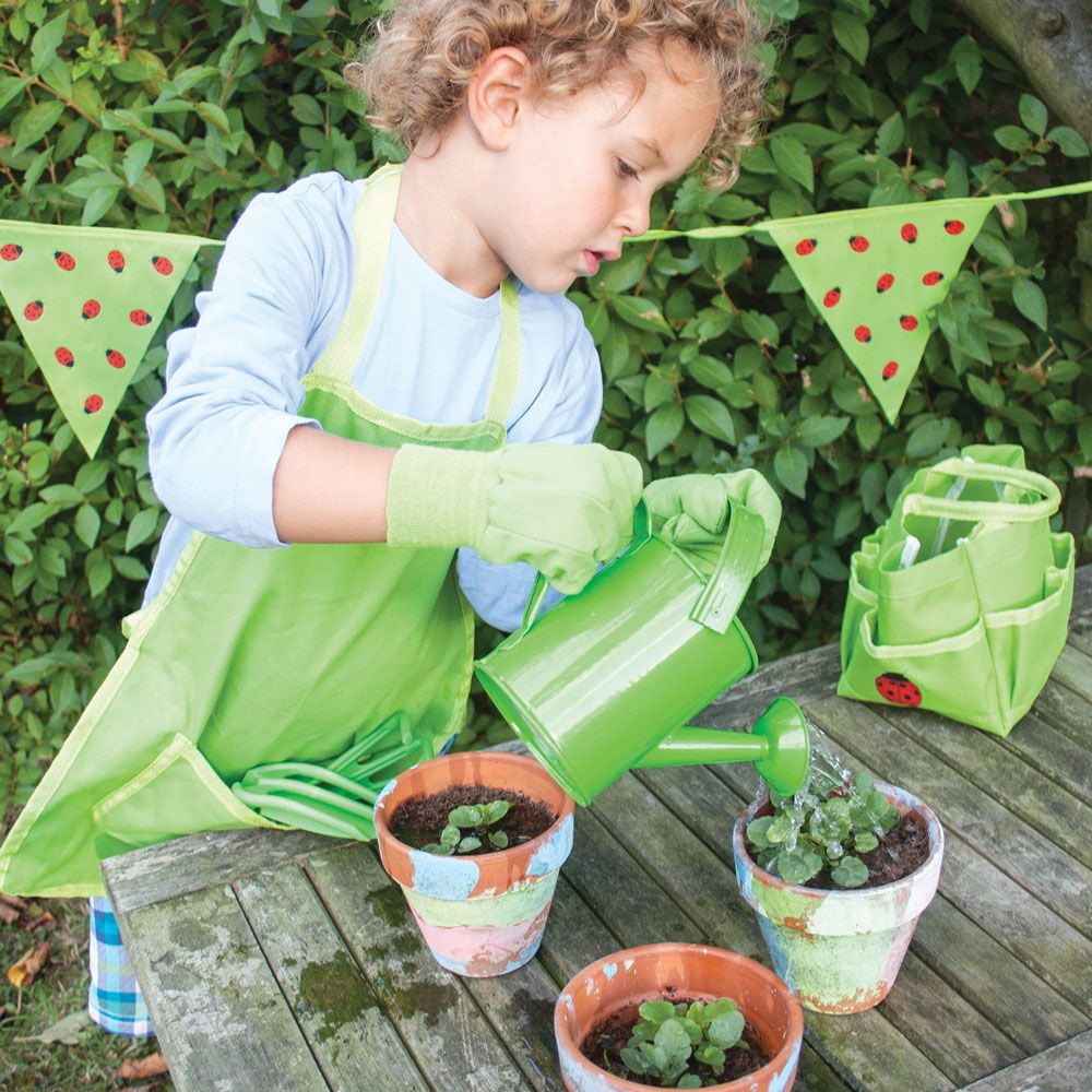 Small Tote Bag with Tools, The Bigjigs Toys Small Tote Bag with Children’s Garden Tools has everything little gardeners need, including a watering can with a fixed spout, elasticated gardening gloves, a hand spade, trowel and rake. The tote bag even has a pretty red ladybird accent. Our children’s gardening set is the perfect place to keep all the garden tools safe. They’re made for real work and are perfect for digging in the dirt next to Mum and Dad. The elasticated wrists on the gardening gloves ensure n