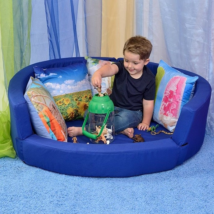 Snuggly Den Blue Cotton, The Snuggly Den Blue Cotton is small enough to fit into most environments our Snuggly Den provides an oasis of calm. The Snuggly Den Blue Cotton is designed with a low front to allow easy access, even this can be removed to make it accessible to even the tiniest customer. The Velcro strip on the base is the 'fluffy' Velcro so children will not scratch their legs when crawling into the Den. Fit it out with our range of accessories to instantly change its use, making this a most versa