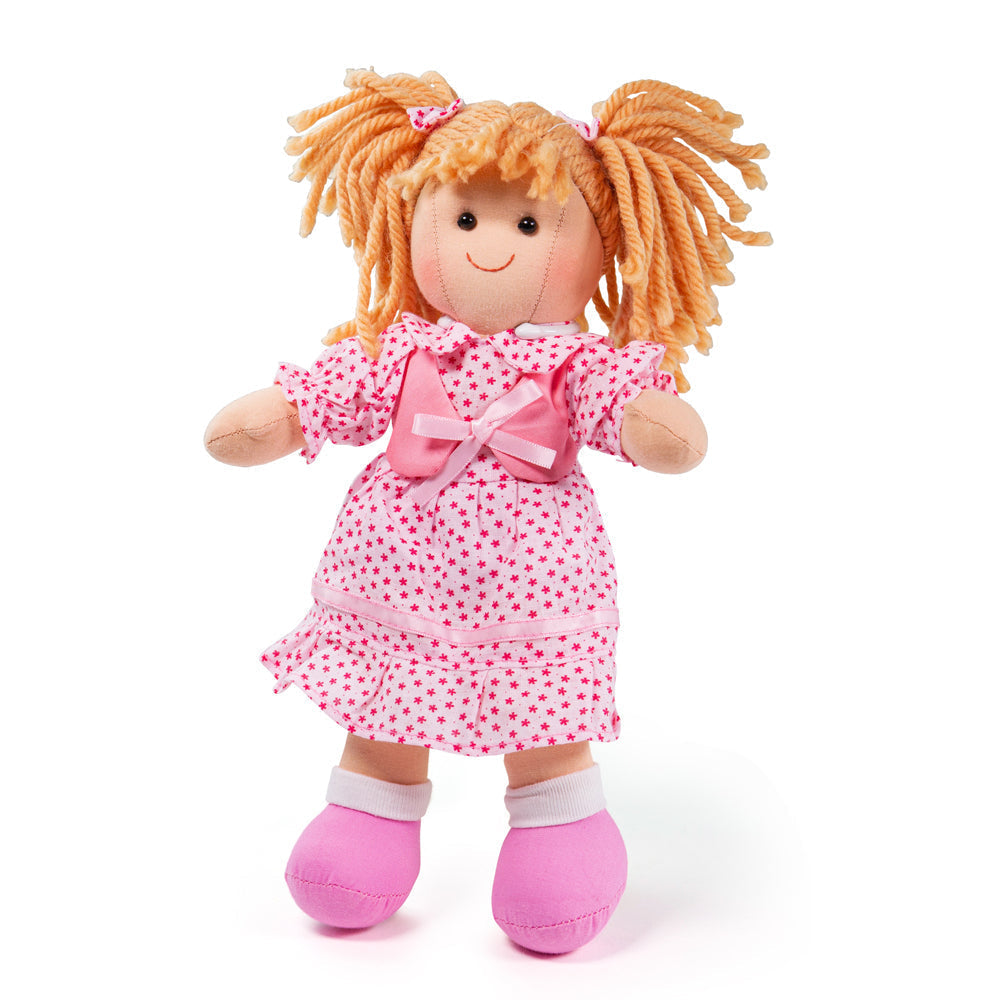Sophie Doll - Small, Introducing Sophie, a soft and cuddly doll who is ready to be your little one's new best friend! With her warm hearted personality, Sophie is eager to share endless playtime fun and lots of comforting hugs.Sophie comes dressed in a smart pink polka dot dress that exudes style and charm. Her matching hair ribbons add a delightful touch, making her simply adorable! Your child will love dressing Sophie up in different outfits using the Bigjigs Toys Doll outfits, which are available separat