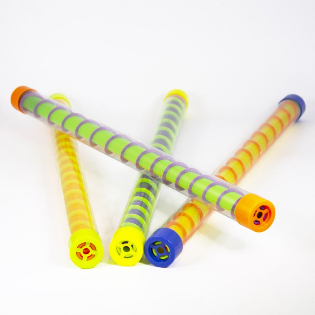 Spiral UV Groan Tube, Our lovely Spiral UV Groan Tubes are a colourful and eye catching fun noise making fun novelty toy. Each Spiral UV Groan Tube is bright and colourful and when turned make a relaxing sound as the pieces fall down the tube. Simply turn the Spiral Groan Tube upside down or give it a shake and listen as the delightful Spiral Groan Tube makes a relaxing sound.The Spiral Groan Tube is helpful for the following skills: Hand and eye co-ordination Gripping Skills Hand Grip and hand muscle exerc