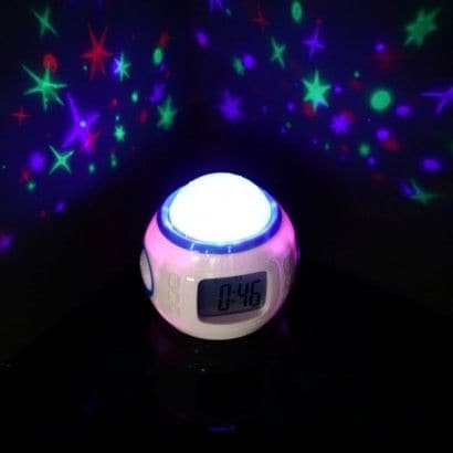 Star Projection Alarm Clock, A starry night light and alarm clock in one, this multi function clock helps you to drop off to sleep and wakes you up in the morning too! Just the right size to fit onto your bedside table, this digital alarm clock displays the time, date and your room temperature and fills your room with colourful star projections to mesmerise as you drift off to sleep. Struggle to relax at bedtime? Soothe yourself to sleep with one of four nature sounds and then set the alarm to wake you with
