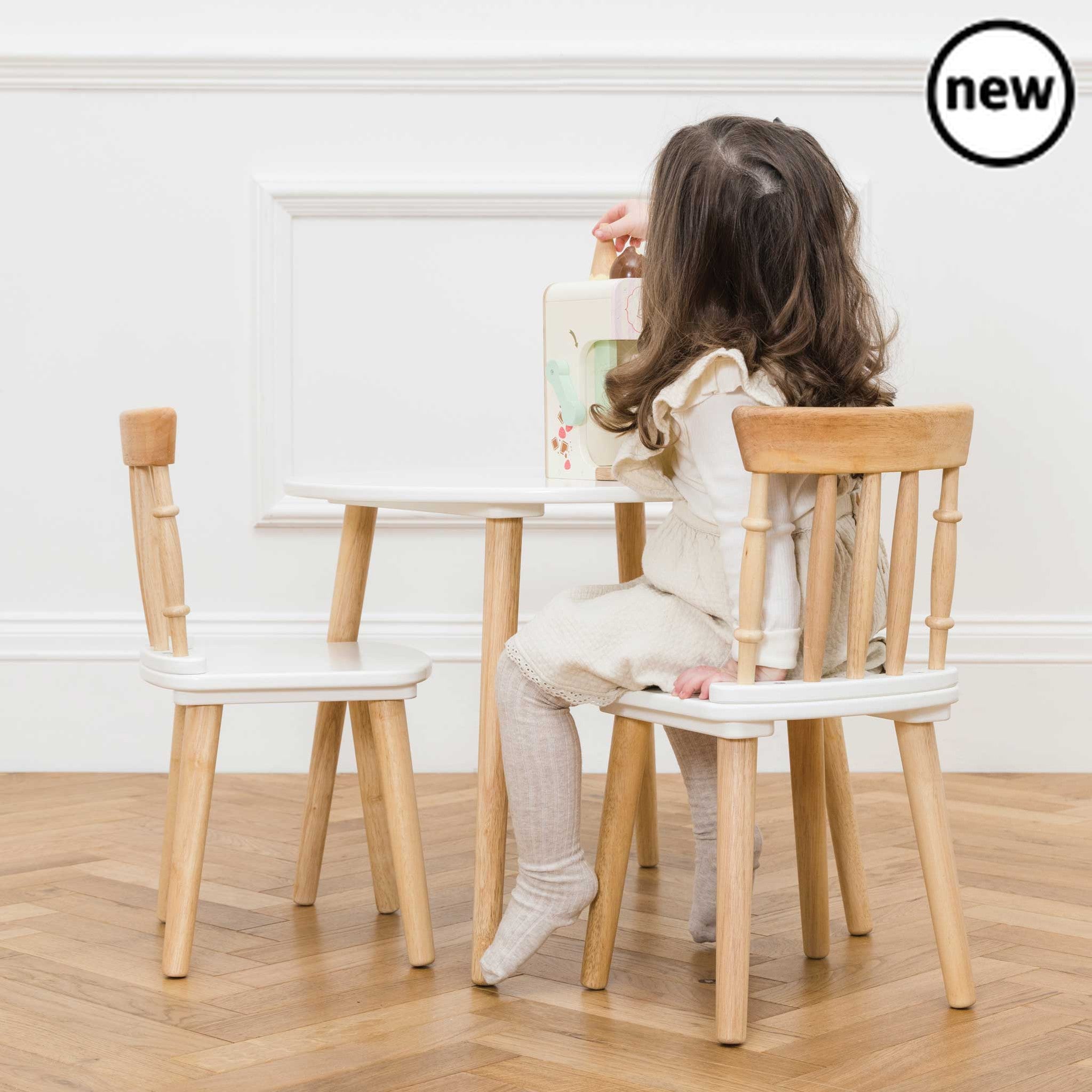 Table and Chairs, Description This charming children's table and chairs set makes a great addition to your littles ones room or playroom. The perfect spot for crafting, eating, reading and role play fun adventures! This multifunctional set is a real must have. With it's timeless appeal and stunning design, it is crafted from solid, sustainable rubberwood and built to last for a lifetime of play. Finished in a combination of fresh white paint and gorgeous exposed wood, it makes a lovely heirloom gift to be t