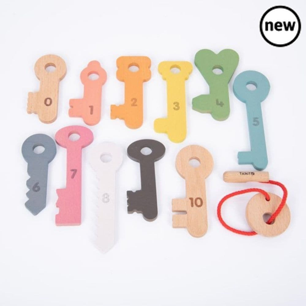 TickiT Rainbow Keys Pack of 11, The TickiT® Rainbow Wooden Counting Keys are an engaging and educational tool for children. Crafted from smooth, solid beechwood, the keys boast a natural woodgrain finish, painted in seven vibrant rainbow colours, along with black, white and natural.Each key is uniquely designed and numbered from 0-10 on one side, with the corresponding number of dots on the reverse. This feature aids in improving your child's counting, sorting and sequencing skills. The tactile keys also he