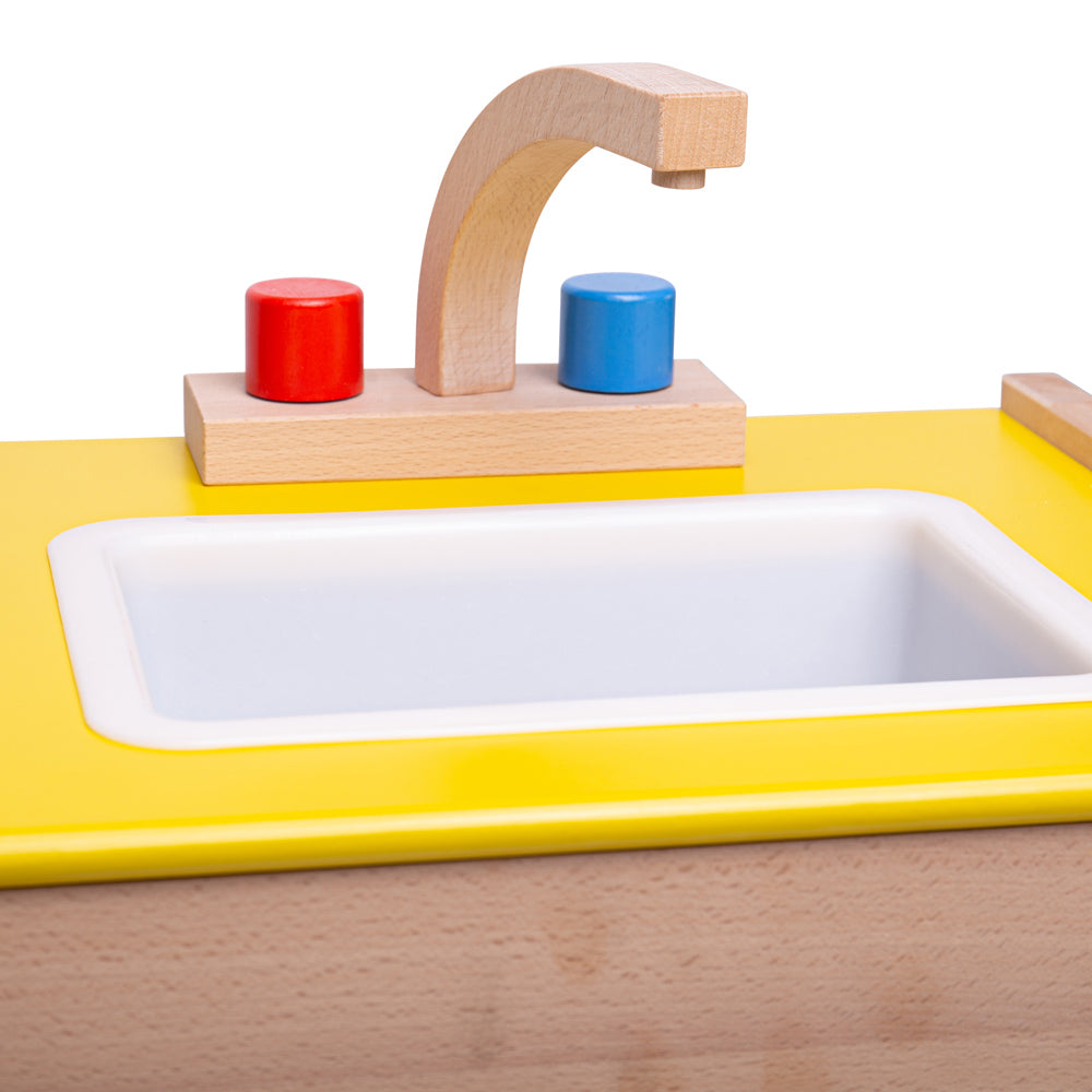 Tidlo Mini Chef Sink, No kitchen is complete without a children's play sink to wash up all of those dirty dinner plates! The Tidlo wooden Play Sink features a tap, front opening door and storage space underneath the sink to store all of those little items. Plus, a play sink with a removable plastic tub for easy cleaning! A great way to teach children the importance of tidying up after they have finished a meal. Features carry handles. Encourages creative and imaginative role-play. Combine with other wooden 