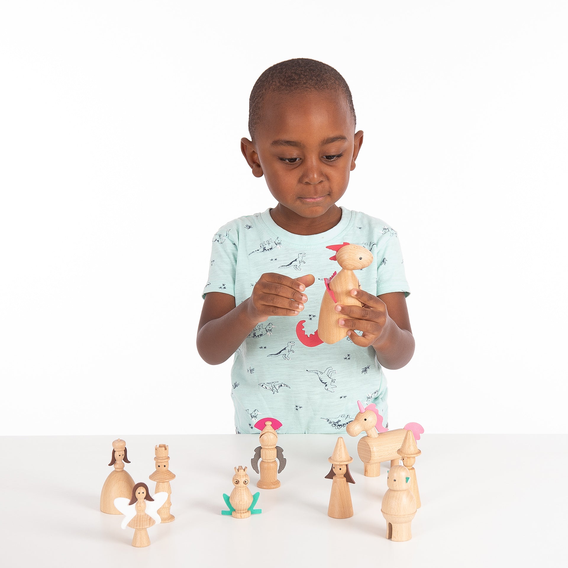 Wooden Enchanted Figures, Your child will love creating their own magical fairy tale with our TickiT® Wooden Enchanted Figures. A spellbinding set of 10 characters from traditional fairy stories made from beautiful solid beechwood, including a king, queen, witch, wizard, fairy, knight, dragon, unicorn, frog-prince and ogre. Natural and smooth with simple printed features and faux leather embellishments, these charming figures are fun and tactile. Your child can use them in imaginative play, small world play
