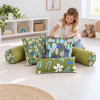 Child arranging the five-piece Olive Printed Cushion Set