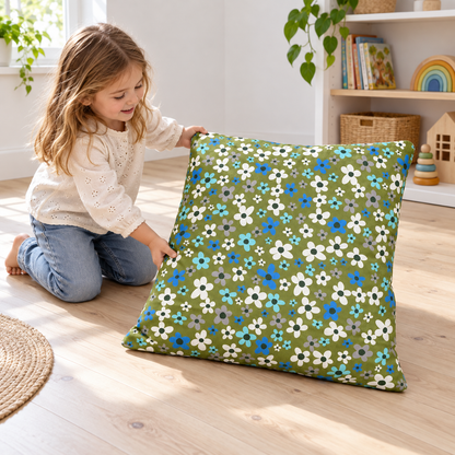 Child arranging an Olive Flowers Square Floor Cushion