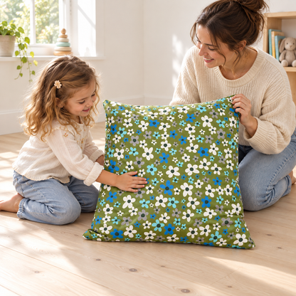 Child and practitioner exploring the floral Square Floor Cushion