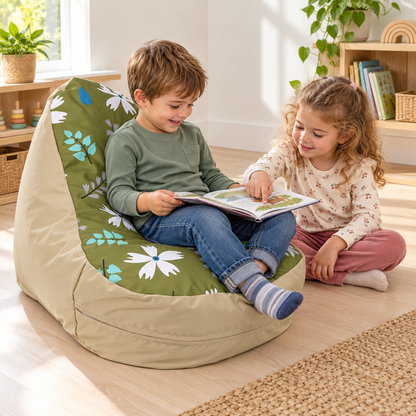 Two children sharing a book with one seated in Beany Lounger