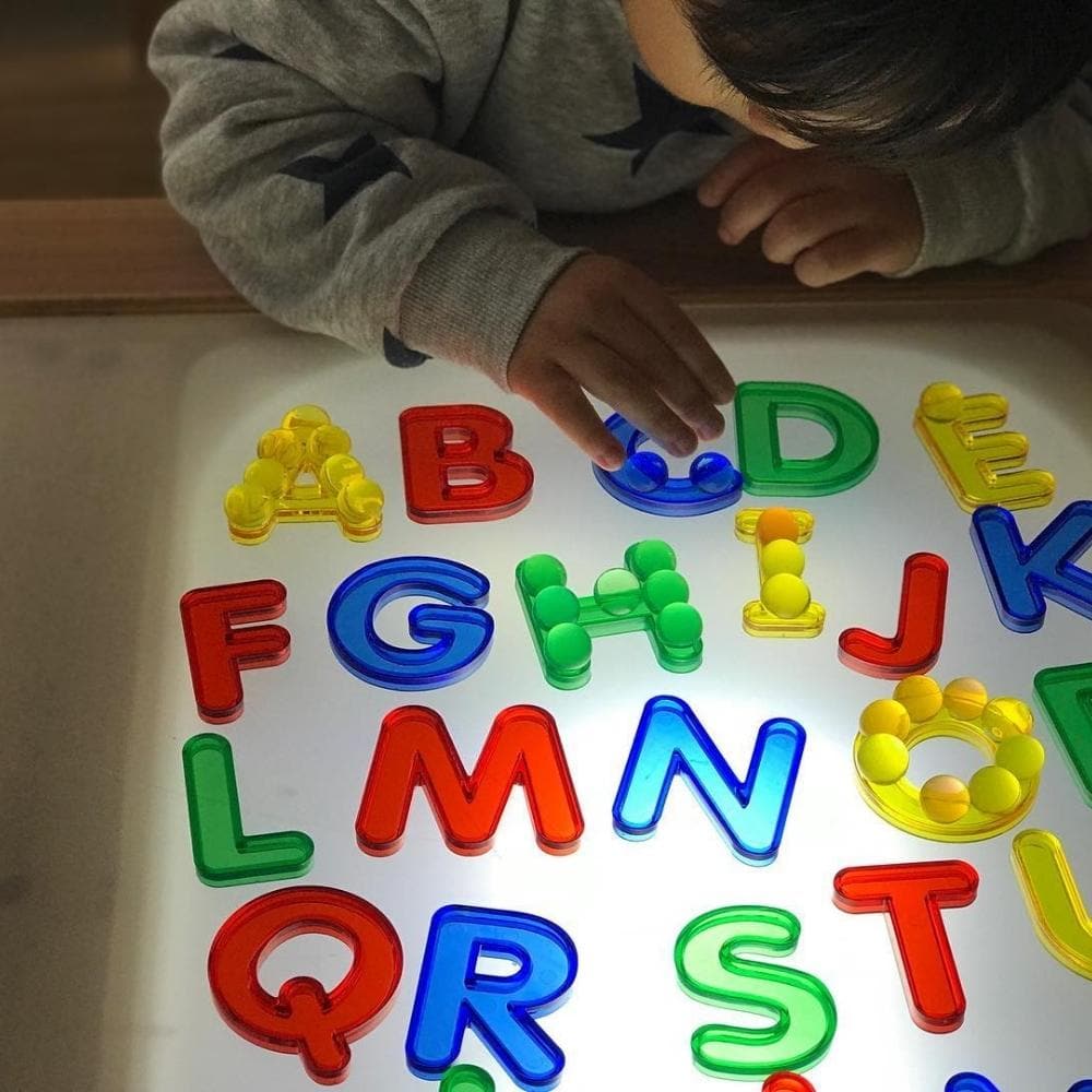 26 Pack Transparent Letters, A set of 26 colourful, transparent letters for sensory light boxes. Each of the Transparent Letters measures approximately 5cm high. The Transparent Letters - Pk26 are excellent for promoting letter recognition in young children. Through playing with these Transparent Letters - Pk26 on the light box, children can learn basic literacy skills and learn to identify word and letter shape and also play with making basic word formations. These Transparent Letters can also be used with