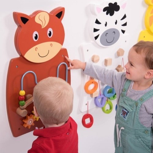 3 Pack Activity Wall Set, The Activity Wall Panel Set of 3 panels will engage children in cross-curricular learning. The Animal Activity Wall Panels are styled as a brown horse with wire beads and moving gears, a yellow giraffe with fruit puzzle blocks to mix and complete, and a black and white zebra with colourful shapes to identify and match. The Animal Activity Wall Panel Toy Set of 3 Supports the following areas of learning: Physical Development - motor skills Maths - shape & space • Personal Developmen