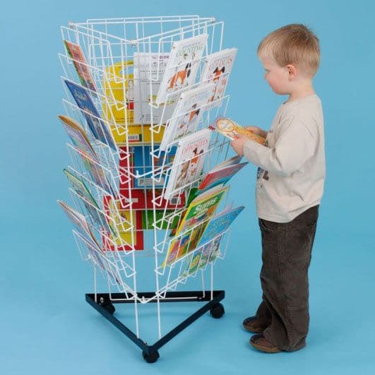 3 Sided Mini Bookrack, The 3 Sided Mini Bookrack has 10 rows on each face, this compact 3 sided mobile book rack provides generous cover-on book storage that can be accessed by a number of children at the same time. The 3 Sided Mini Bookrack is a useful mobile wire book racks which is floor standing and plastic coated for easy cleaning make this perfect for all classrooms and early years settings. Store books with style. Size: L58x W58 x H103cm., 3 Sided Mini Book Rack,3 Sided Mobile Book Rack,school book r