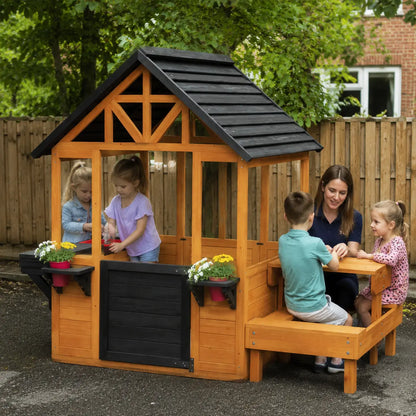 Wooden Playhouse with Table, Benches and Sink – Natural lifestyle play scene 1