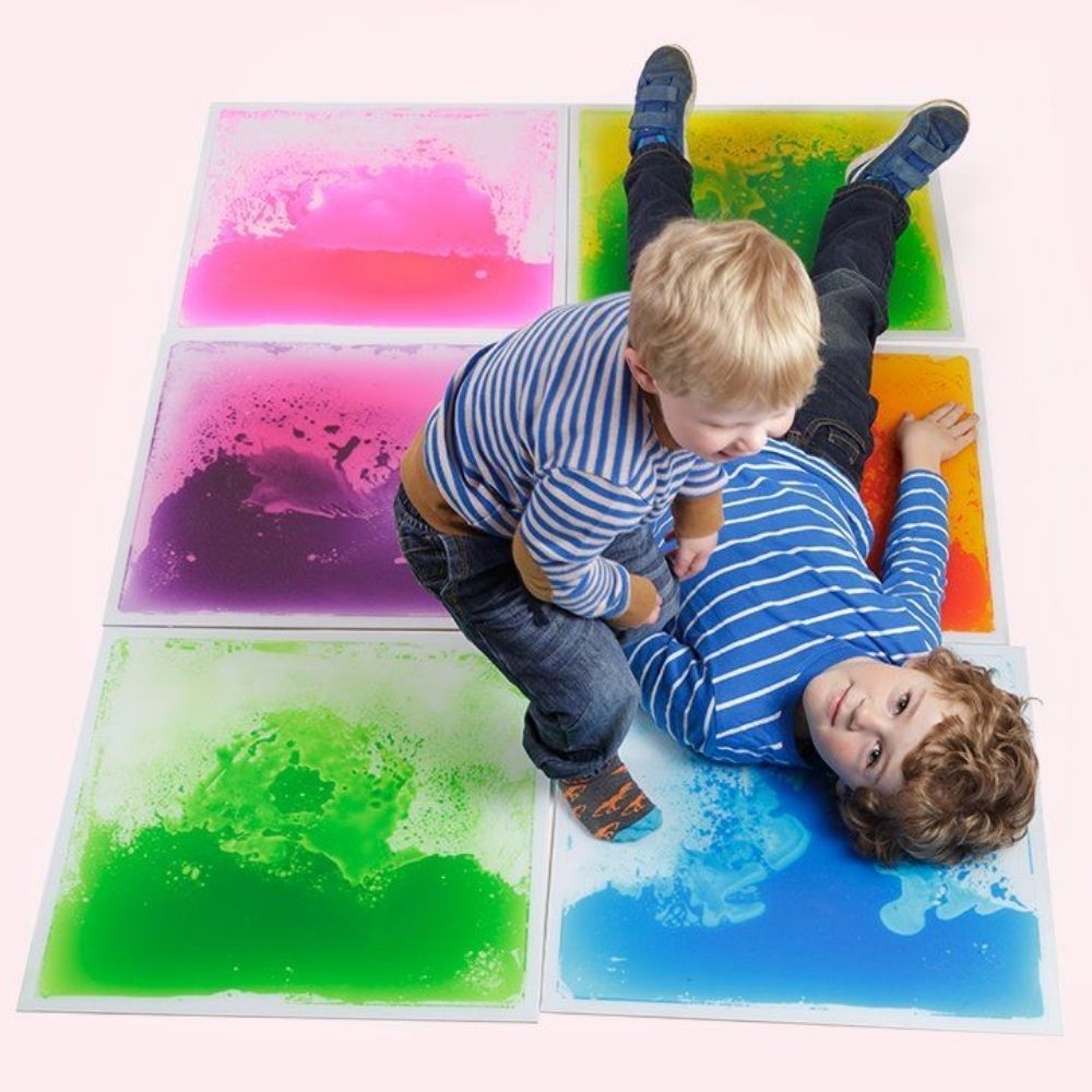 4 Pack Mixed Colours Sensory Liquid Tiles, The sensory liquid tiles are a wonderful visual and tactile experience, that really does encourage you to move around and explore the surfaces. The sensory liquid floor tiles contain flowing colours that swirl around as you move about on them. The sensory liquid tiles will withstand jumping on and strenuous use by children and adults as well as the weight of wheelchairs. The Sensory Liquid floor tiles can also be used on a table top of any flat surface. Simply Appl