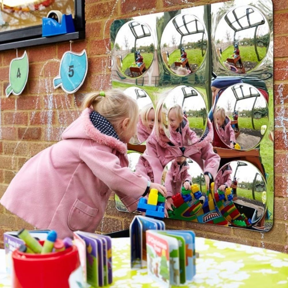 9 Bubble Outdoor Mirror, Perfect for outdoor play areas, this 9 Bubble Outdoor Mirror will captivate children and adults alike.Featuring a unique design, this 9 Bubble Outdoor Mirror duplicates images and changes their shape and size, creating an interactive and dynamic sensory experience. Whether you're a therapist looking to engage your clients or a play specialist seeking to create an exciting play area, this 9 Bubble Outdoor Mirror is the perfect addition to any outdoor space.The 9 Bubble Outdoor Mirror
