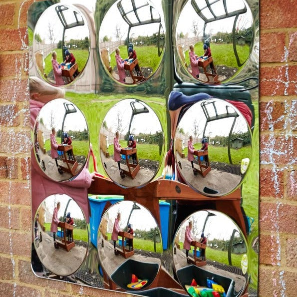 9 Bubble Outdoor Mirror, Perfect for outdoor play areas, this 9 Bubble Outdoor Mirror will captivate children and adults alike.Featuring a unique design, this 9 Bubble Outdoor Mirror duplicates images and changes their shape and size, creating an interactive and dynamic sensory experience. Whether you're a therapist looking to engage your clients or a play specialist seeking to create an exciting play area, this 9 Bubble Outdoor Mirror is the perfect addition to any outdoor space.The 9 Bubble Outdoor Mirror