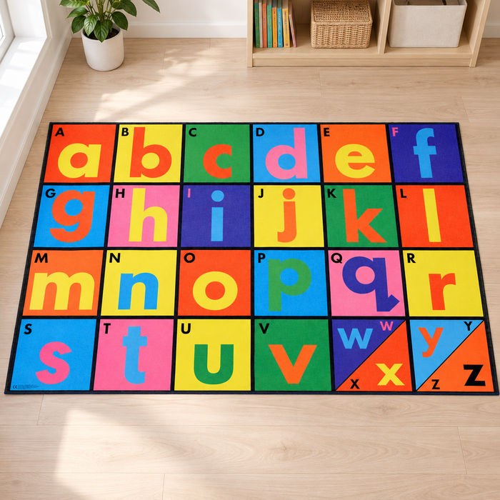 Alphabet Playmat 1.5m x 1m with coloured uppercase and lowercase letters on a pale wooden nursery floor