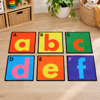 Selection of six separate Alphabet Floor Tiles showing A to F in an early years play setting