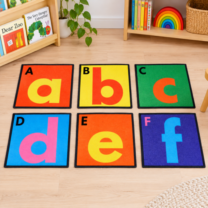 Selection of six separate Alphabet Floor Tiles showing A to F in an early years play setting