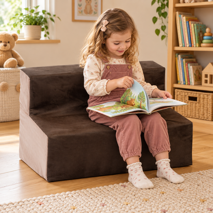 Child using 700mm wide suede sofa with 300mm seat height during reading and play in a nursery