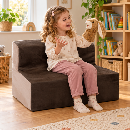 Child using 700mm wide suede sofa with 300mm seat height during reading and play in a nursery