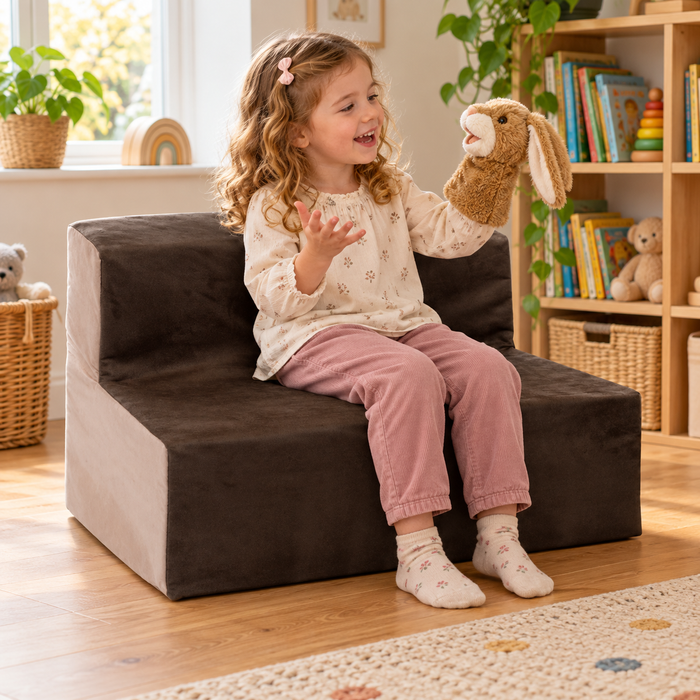 Child using 700mm wide suede sofa with 300mm seat height during reading and play in a nursery