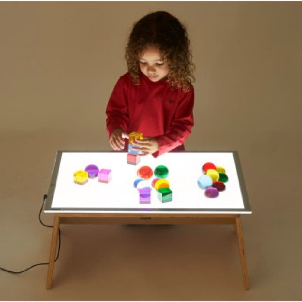 A2 Light Panel & Table Set, The A2 Light Panel & Table Set is complete resource for imaginative and exploration play in a unique fun way. The A2 Light Panel & Table Set is an essential and versatile cross-curricular resource. With a new anti-trip magnetic connector and 3 light level settings they provide a cool, clean, bright illuminated background and are ideal for the investigation of light, colour and shape, or for focused group work in a wide range of subjects. The A2 Light Panel & Table Set comes with 