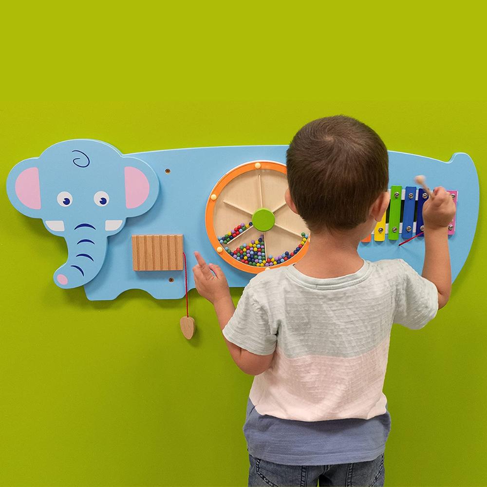 Activity Wall Panel Elephant, An appealing manipulative wall panel in a Elephant design, providing a range of fine motor activities several children can enjoy at once. The Activity Wall Panel Elephant is visually captivating and providing a range of interesting manipulative activities for a single child or group of children playing and exploring together. Excellent for the development of hand-eye coordination, finger control and fine motor skills. Also providing problem solving challenges appropriate to you