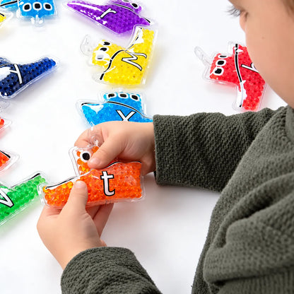 Alpha Rainbow Gel Boats Pack 26 – child exploring gel-filled alphabet boats – view 2