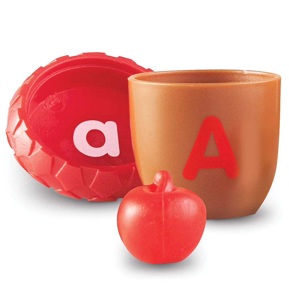 Alphabet Acorns Activity Set, This fun and challenging Alphabet Acorns Activity Set gives children multiple ways to learn and play. Children can match uppercase and lowercase letters as they put the acorns together, plus play hide-and-seek by finding a surprise inside each acorn. The object they find begins with the letter sound on the acorn. Colours correspond to letters, and little learners can even practice making words, learning their ABCs, beginning sounds, and more! Alphabet Acorns Activity Set This c