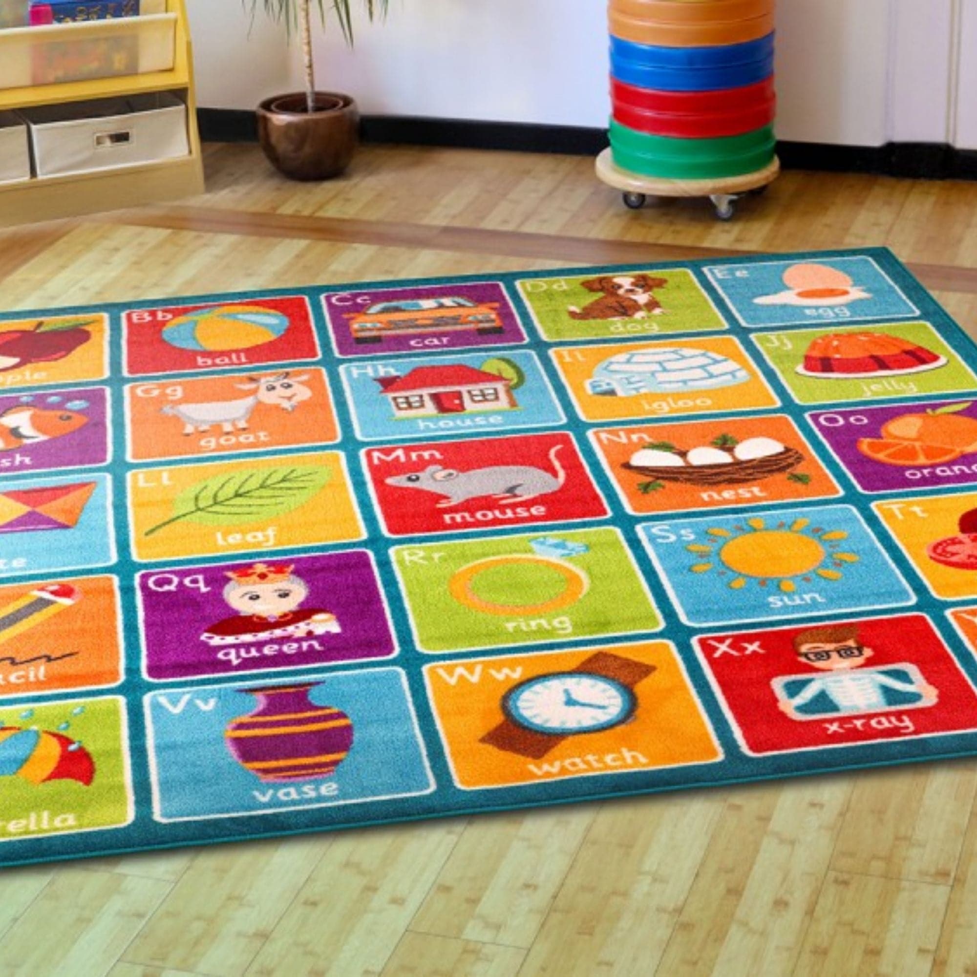 Alphabet Square Carpet, This Square Alphabet Carpet is perfect for children to sit and enhance learning word and letter recognition in a fun interactive way. The Square Alphabet Carpet features distinctive and brightly coloured, child friendly designs The Square Alphabet Carpet is designed specifically with Key Stage 1, Literacy curriculum relevance in mind. Word, letter and picture associations using clearly identifiable Infant font in upper and lowercase. The Alphabet Square Carpet is a large colourful 2 