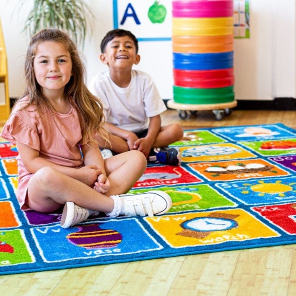 Alphabet Square Carpet, This Square Alphabet Carpet is perfect for children to sit and enhance learning word and letter recognition in a fun interactive way. The Square Alphabet Carpet features distinctive and brightly coloured, child friendly designs The Square Alphabet Carpet is designed specifically with Key Stage 1, Literacy curriculum relevance in mind. Word, letter and picture associations using clearly identifiable Infant font in upper and lowercase. The Alphabet Square Carpet is a large colourful 2 