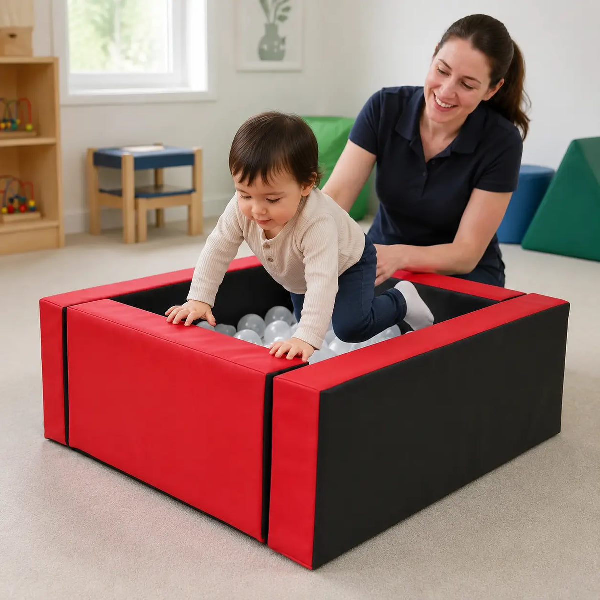 Baby Moves Neuro Ball Pool in a naturally lit supervised early-years sensory play setting