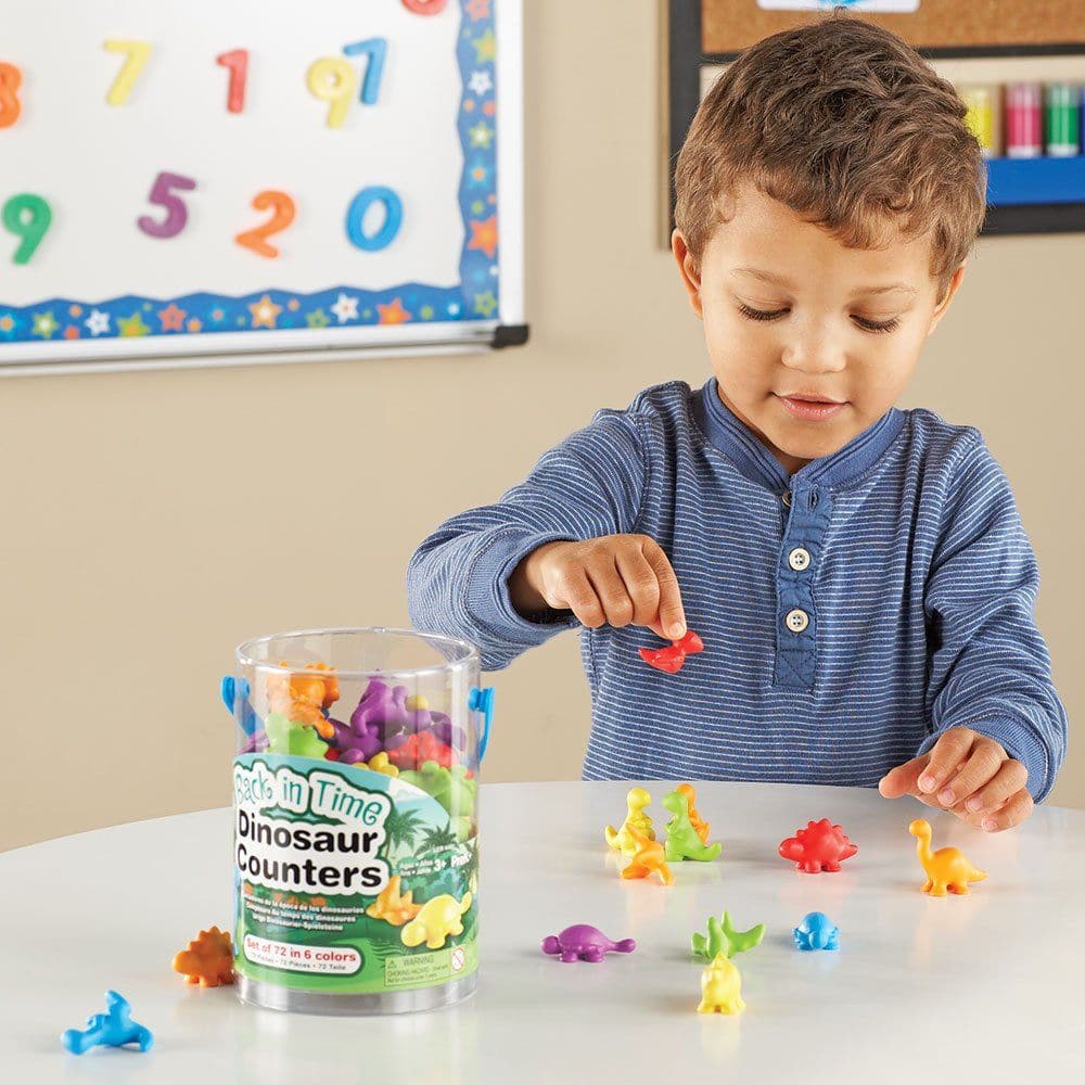 Back In Time Dinosaur Counters Set of 72, Welcome to a world where learning meets fun! The unique and attractive Back In Time Dinosaur Counters™ are here to infuse vibrancy and excitement into early maths activities. These counters aren’t just educational tools; they are colorful buddies turning every learning session into a joyful adventure! 🌈 Vibrant & Engaging: With their modern design and bright colors - Blue, Red, Orange, Yellow, Green, and Purple, these dinosaur counters are set to captivate young min